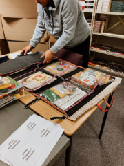 Our General Assistant packing the hanging library