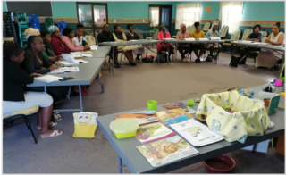 Practitioners from ECD Centres affiliated to Lulamaphiko attending a training session while using the resources donated by Biblionef