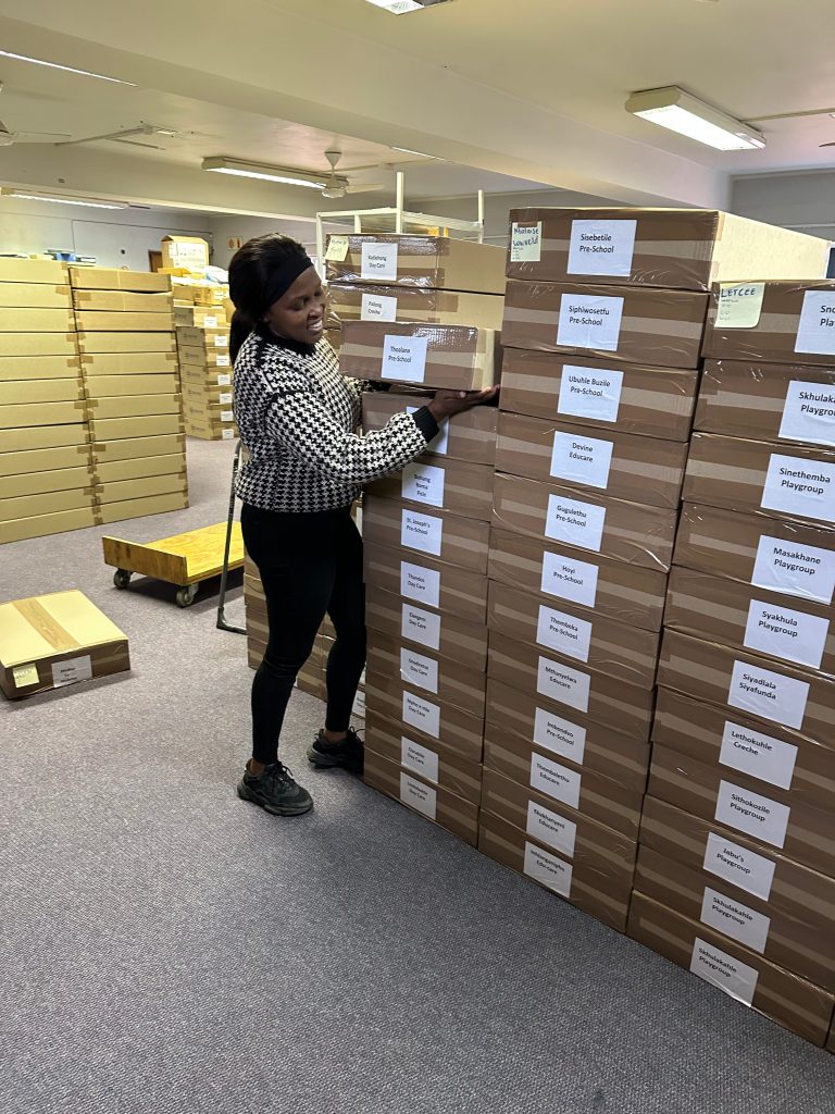 Our Programme Implementation Officer preparing the donation of books to be sent off