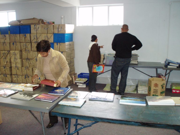 Staff preparing books for distribution