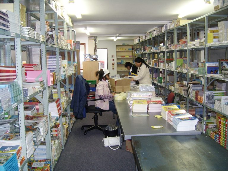 Our staff unpacking books that arrived at our office