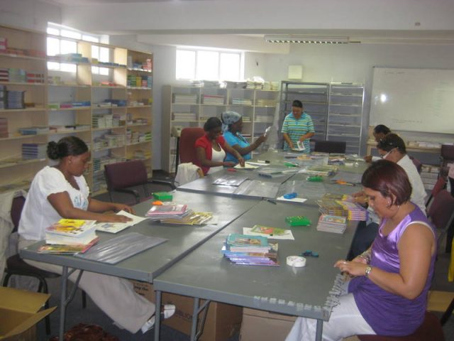 Skilled women were employed to cover books for Biblionef_s projects, providing paid work while helping prepare books for distribution_