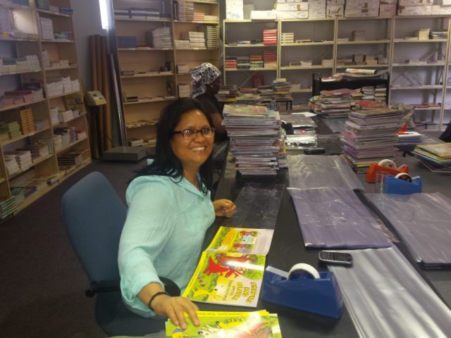 Skilled women were employed to cover books for Biblionef_s projects, providing paid work while helping prepare books for distribution_(1)